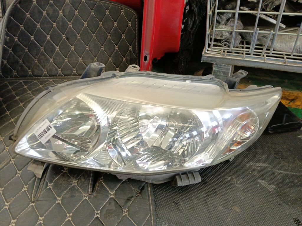 Фара на Toyota Corolla ZRE150L 02-130, Левое расположение