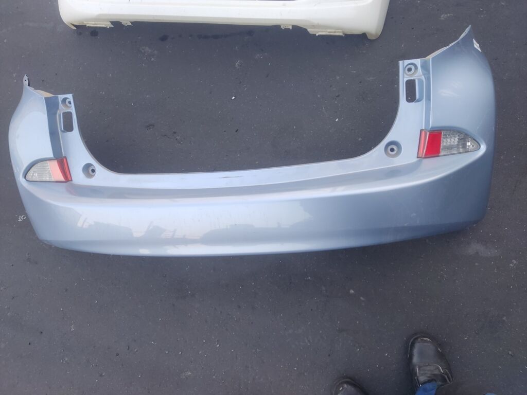 Бампер на Toyota Ractis NCP120 52159-52730, Заднее расположение