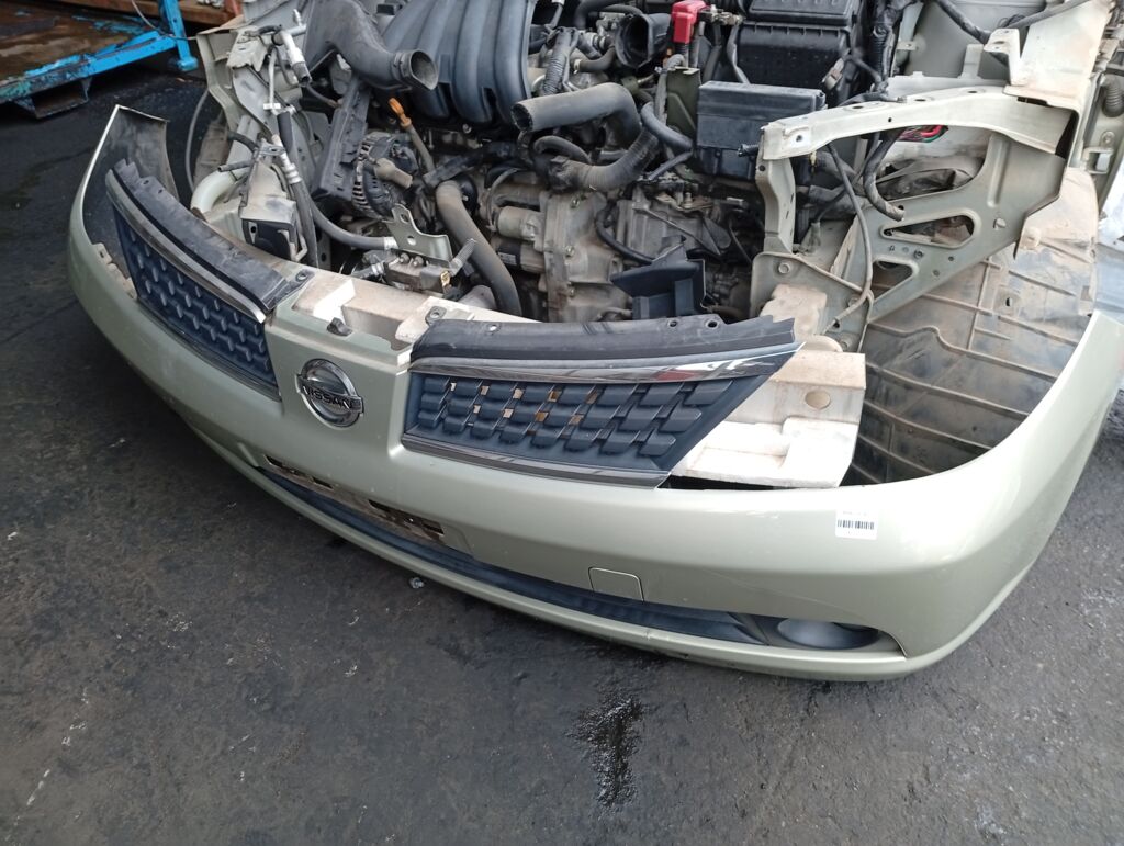 Бампер на Nissan Tiida C11 02B2704 62022-ED025  62022ED025  62022ED540  62022EM00J  DS04213BA  DS04232BA  DS04232BB  DT20100000000  DT20200001000  GD6930  HQ62022EM00J  NS01001DB  NSL10507507  STDTW5000A0  U0505084  UNTEM622294, Переднее расположение