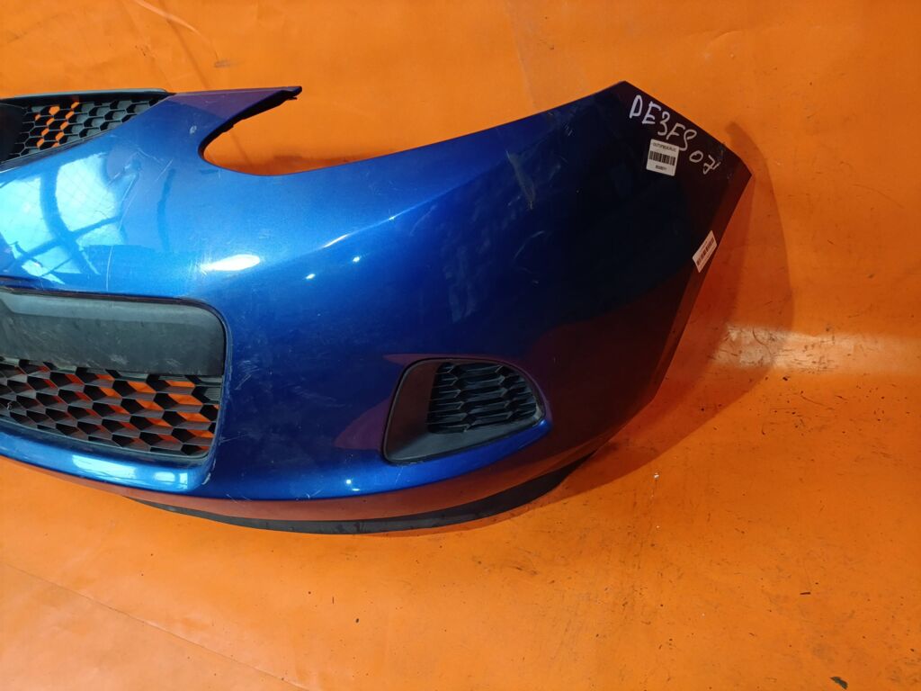 Бампер на Mazda Demio DE3FS 038D65150031C8N  25301967  2741570  3421901  5605050  931104  D65150031B8H  D65150031BAA  D65150031C8N  D65150031CAA  D65150031CBB  MZ04105BA  MZ04105BAV  MZ04105BB  MZ51100000000  STMZ520000, Переднее расположение