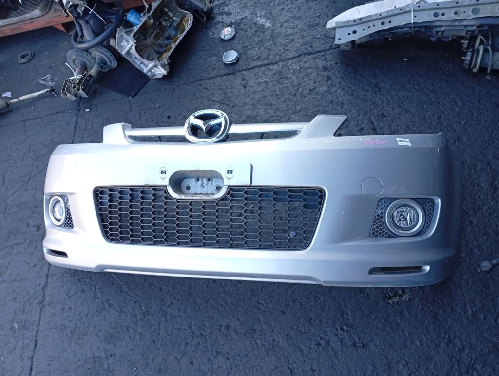 Бампер на Mazda Demio DY5W 114-61009, Переднее расположение