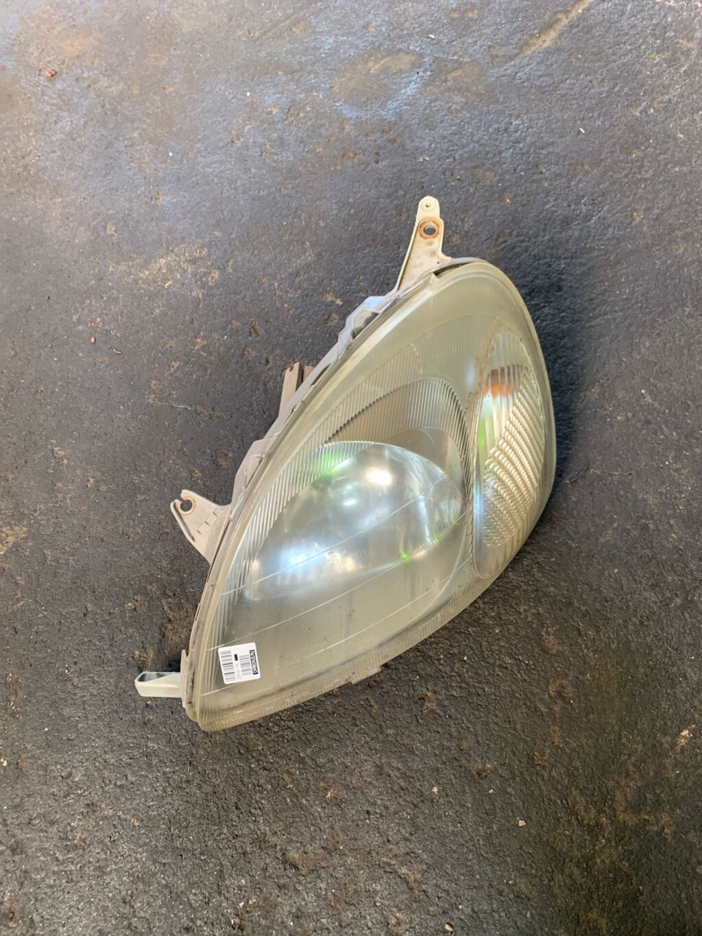 Фара на Toyota Vitz SCP10 52-001, Левое расположение